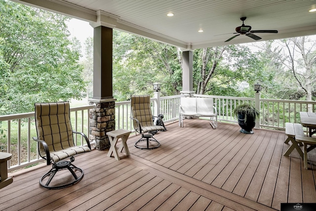 wooden deck featuring ceiling fan