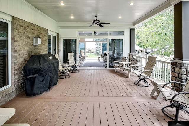 deck with area for grilling, covered porch, and ceiling fan