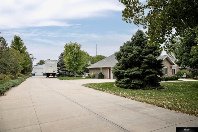 view of front of home featuring a garage and a front yard