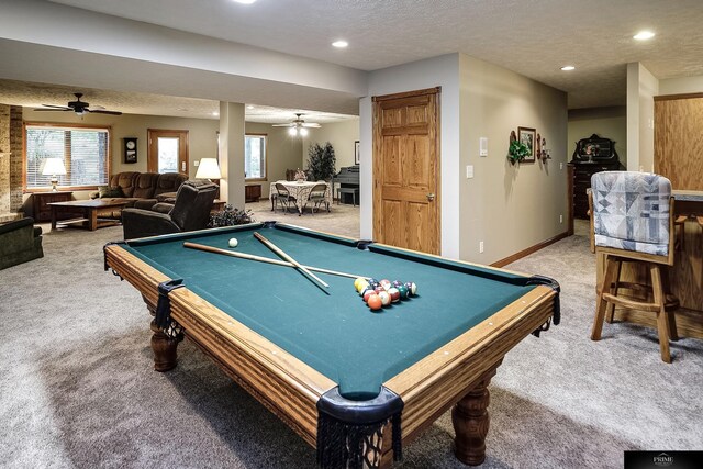 playroom featuring a textured ceiling and carpet