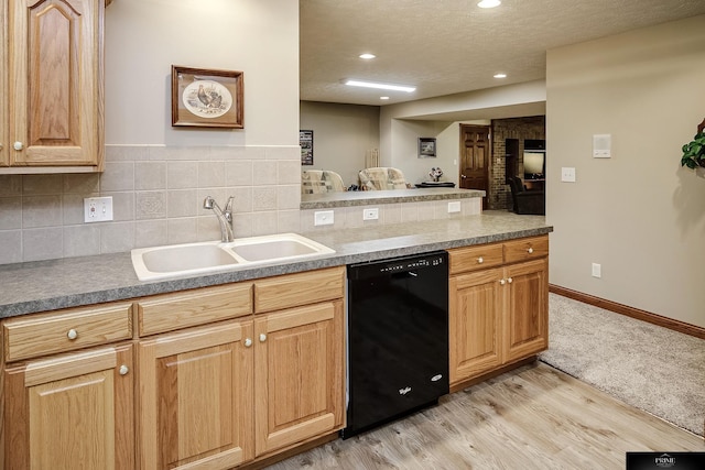 kitchen with light hardwood / wood-style flooring, dishwasher, sink, a textured ceiling, and decorative backsplash