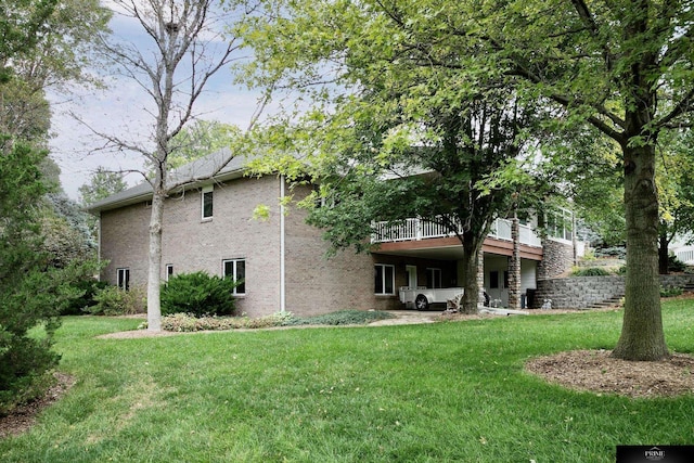 back of house with a yard and a deck