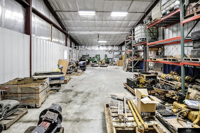 misc room with a workshop area and concrete flooring