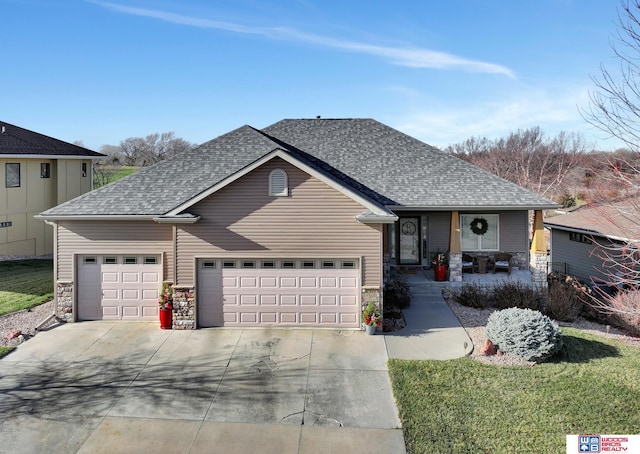 single story home featuring a front yard and a garage