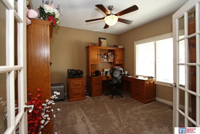 office area featuring ceiling fan, french doors, dark colored carpet, and plenty of natural light