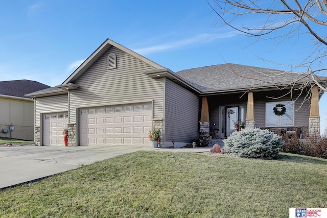 view of front facade with a garage and a front yard