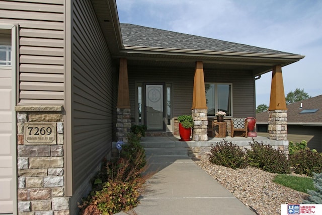 doorway to property featuring a porch