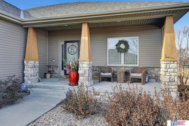 entrance to property featuring covered porch