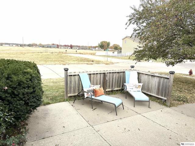 view of patio / terrace with a rural view