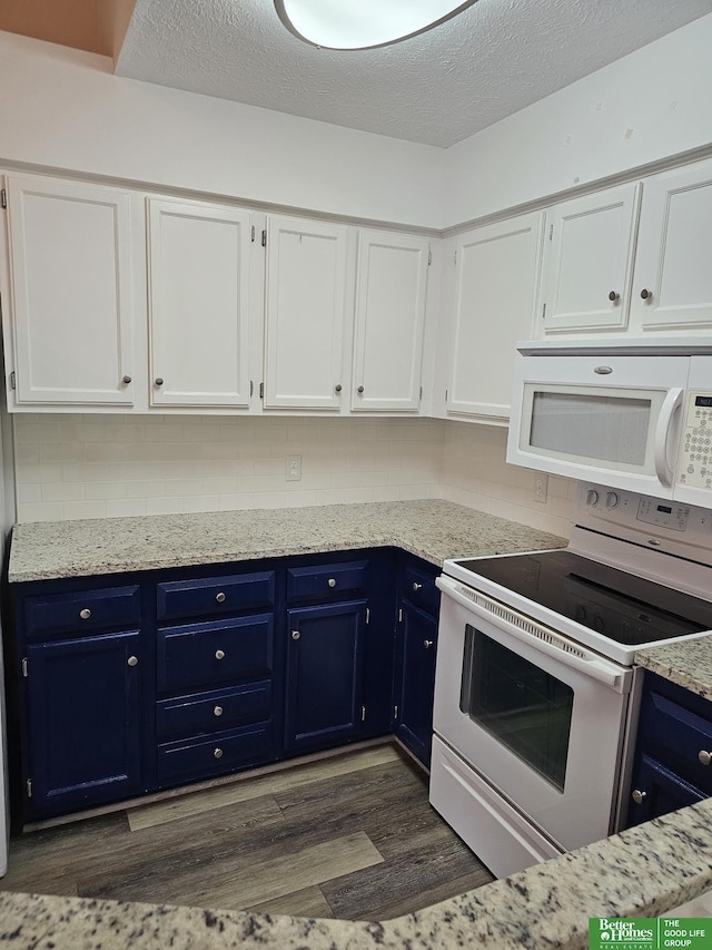 kitchen featuring white appliances, backsplash, a textured ceiling, white cabinets, and dark hardwood / wood-style flooring