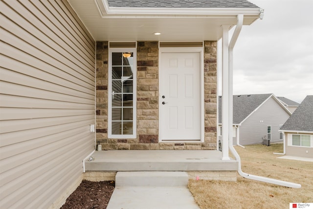 doorway to property featuring central AC