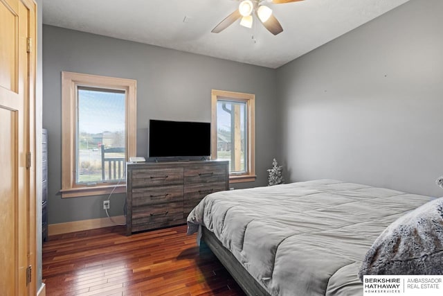 bedroom featuring ceiling fan and dark hardwood / wood-style flooring