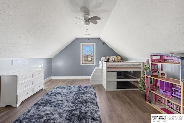 bedroom featuring a textured ceiling, vaulted ceiling, ceiling fan, and dark hardwood / wood-style flooring