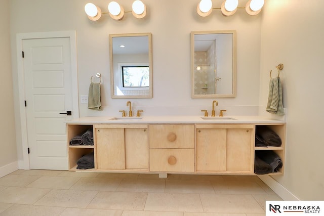 bathroom with tile patterned floors and vanity