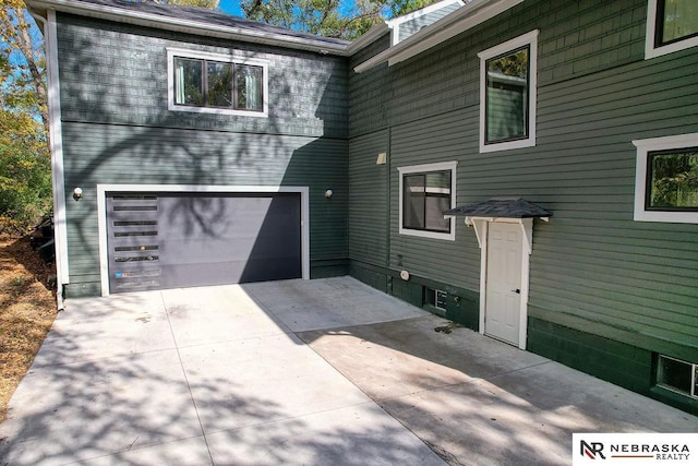 view of side of property featuring a garage