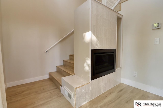 stairs with wood-type flooring