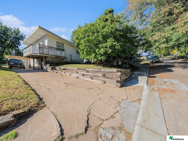 view of side of home with a deck