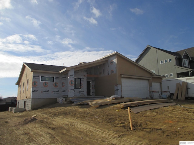 unfinished property with a garage