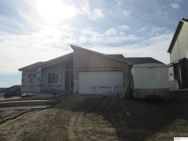 view of side of home featuring a garage