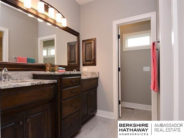 bathroom with vanity and tile patterned floors