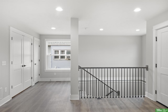 hallway featuring hardwood / wood-style flooring