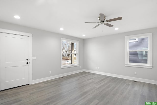 unfurnished room featuring ceiling fan and light hardwood / wood-style floors