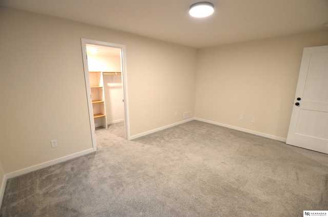 empty room featuring light carpet