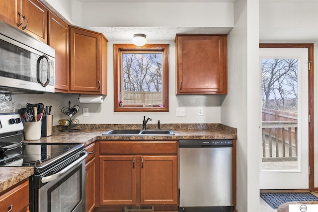 kitchen with sink, plenty of natural light, and appliances with stainless steel finishes