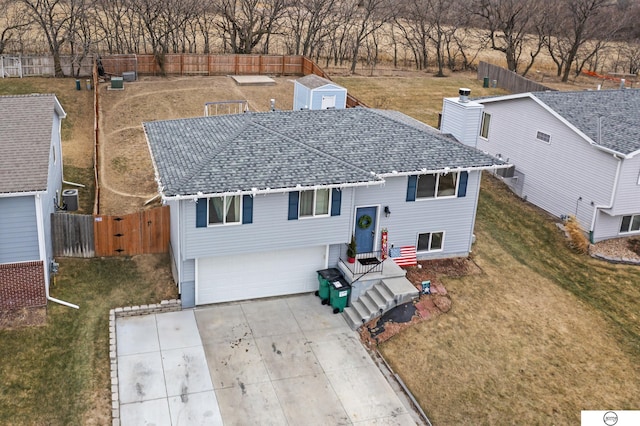 view of front of home featuring a garage and a front yard