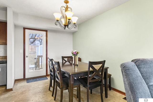 dining area featuring a notable chandelier