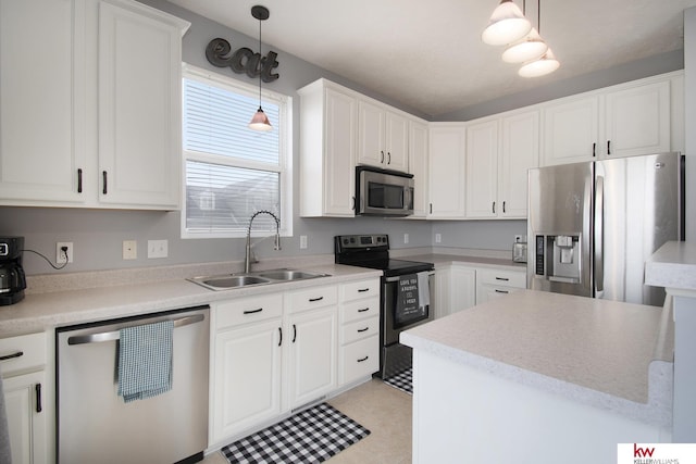 kitchen featuring light tile patterned flooring, pendant lighting, sink, white cabinets, and stainless steel appliances