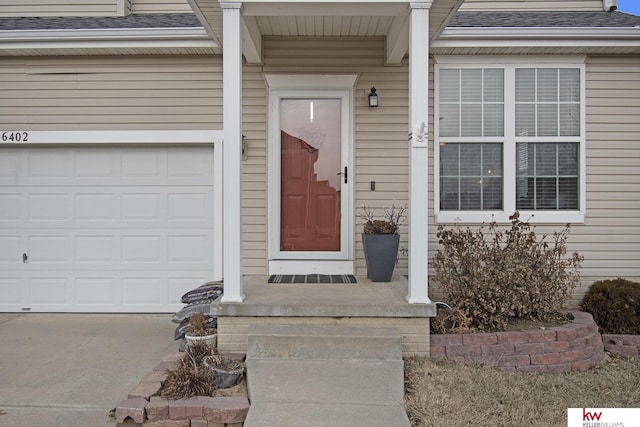 property entrance with a garage