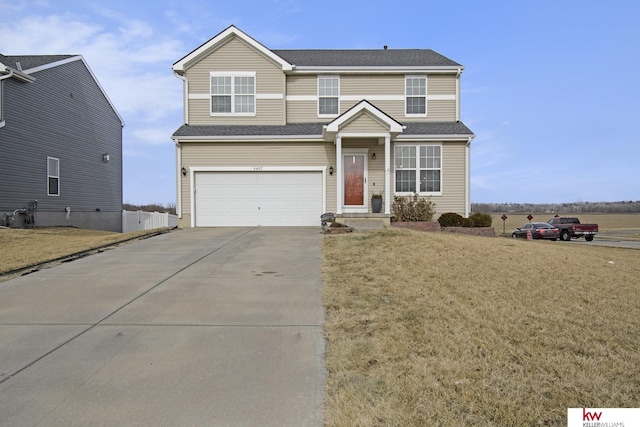 view of front of house featuring a garage and a front yard