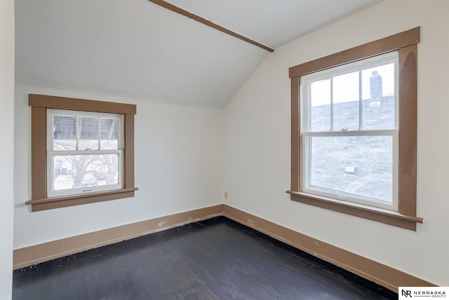 additional living space with dark hardwood / wood-style flooring and lofted ceiling