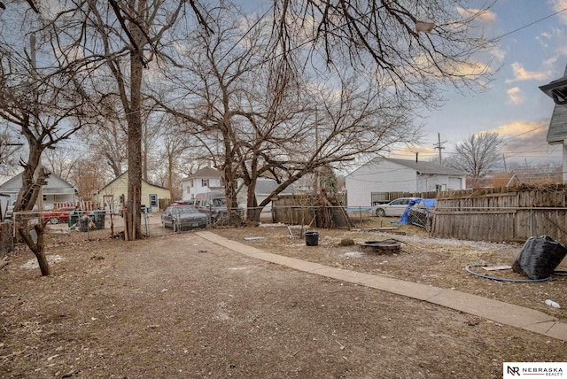 view of yard at dusk