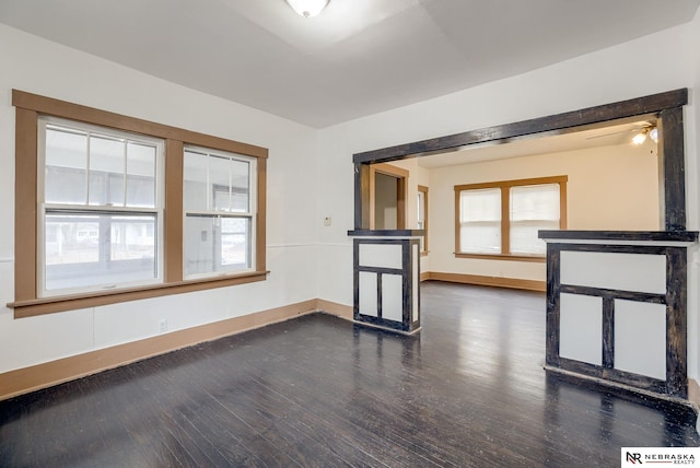 unfurnished room featuring dark hardwood / wood-style floors