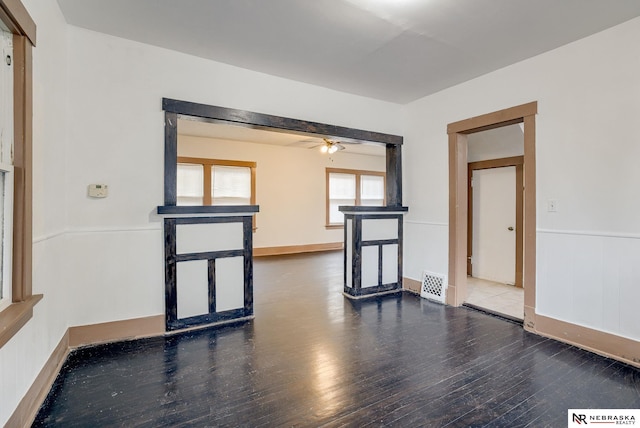 unfurnished room with wood-type flooring and ceiling fan