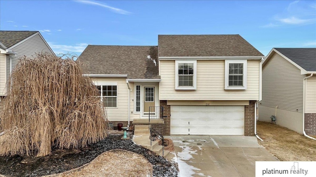 split level home with a garage