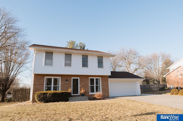 view of property with a front yard and a garage