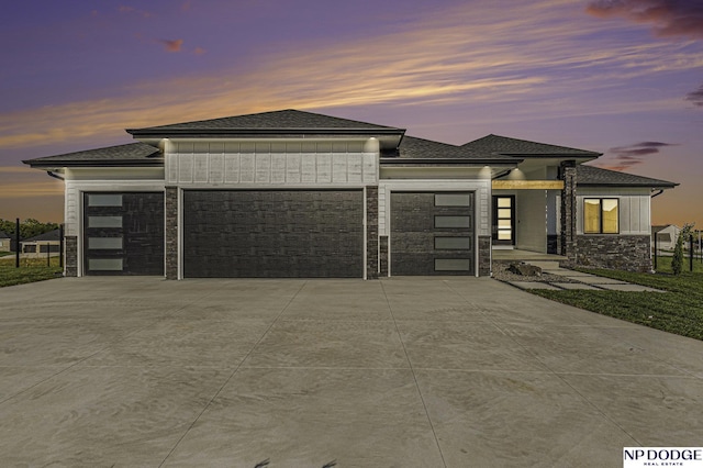 prairie-style home featuring a garage