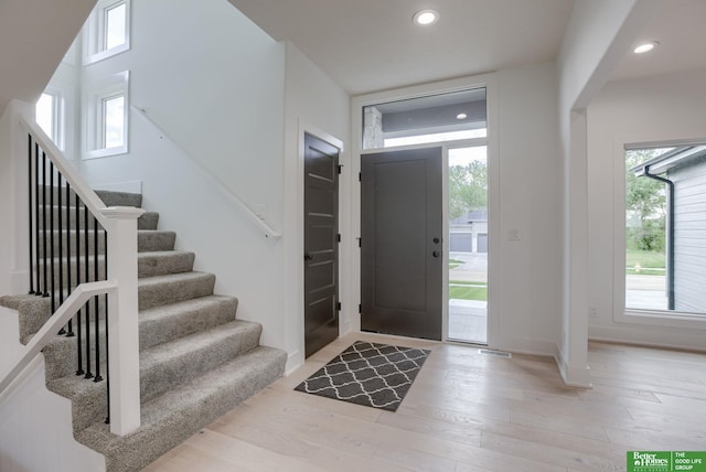 entrance foyer with light hardwood / wood-style flooring and a wealth of natural light