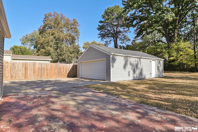 garage featuring a lawn