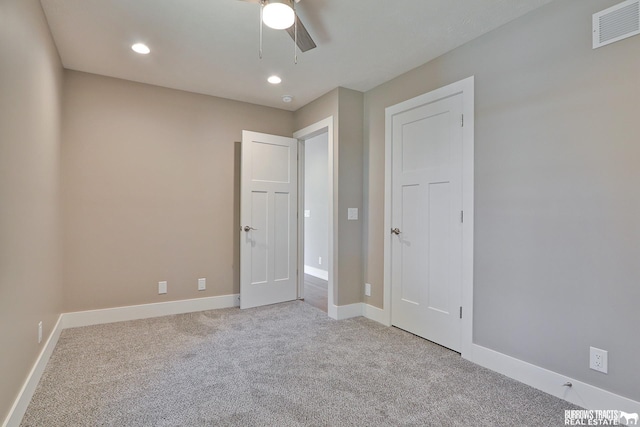 empty room featuring light carpet