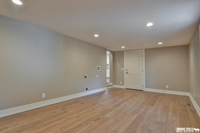 unfurnished room featuring light wood-type flooring