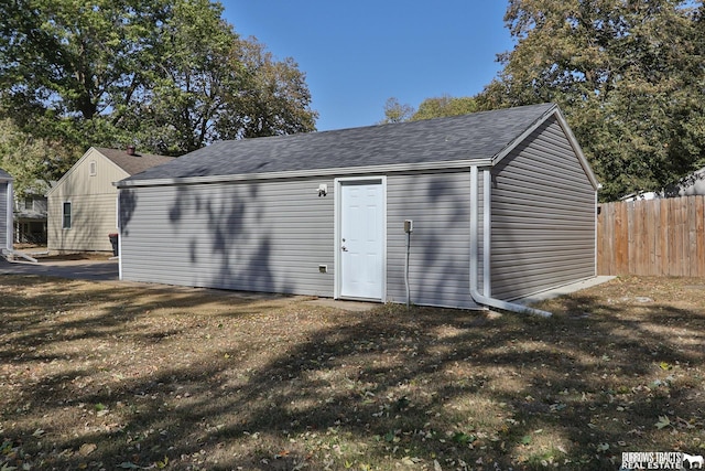 view of outbuilding featuring a yard