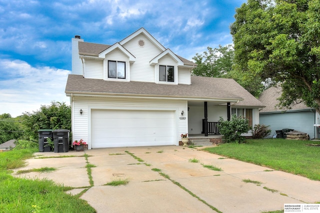 view of front of house with a porch, a garage, and a front yard