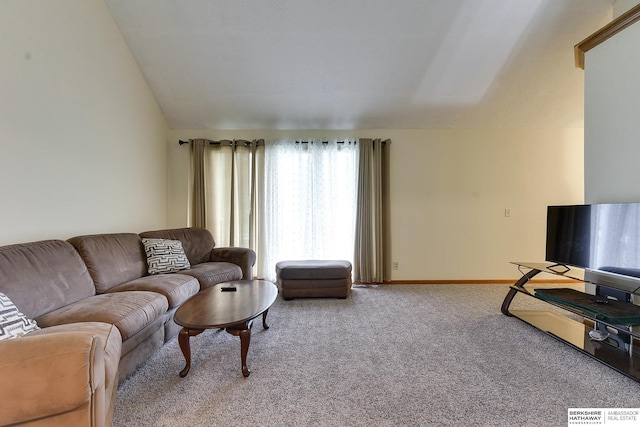 carpeted living room with vaulted ceiling