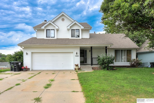 view of front facade with a garage, a porch, and a front yard