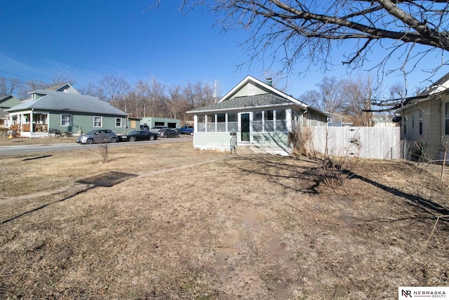 exterior space featuring a sunroom