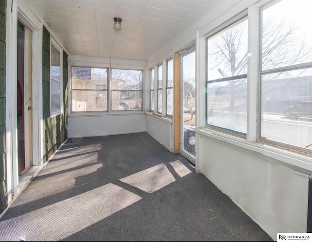 unfurnished sunroom featuring a healthy amount of sunlight